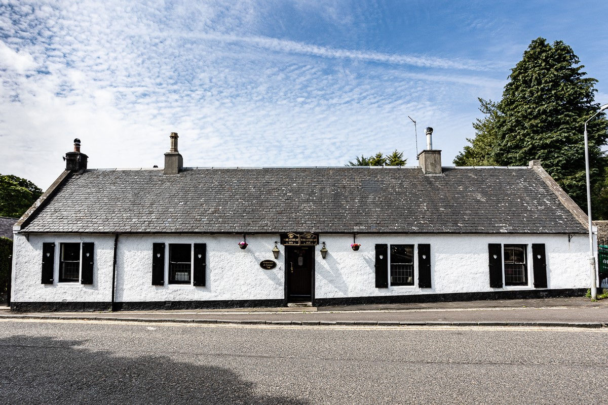 The restaurant interior at The Wheatsheaf Inn, a traditional dining room with a lived-in, welcoming character.